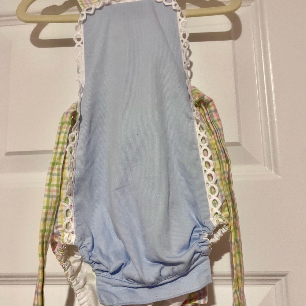 Blue 9M sunsuit with rainbow plaid straps and side ties